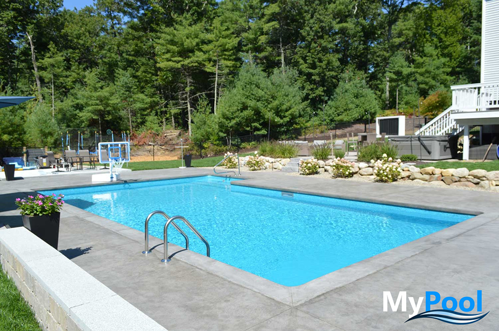 Clean backyard pool maintained with consistent weekly chlorine care