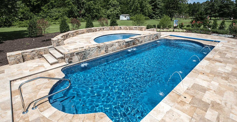 Clear Minnesota backyard pool showing proper chlorine care and clean water