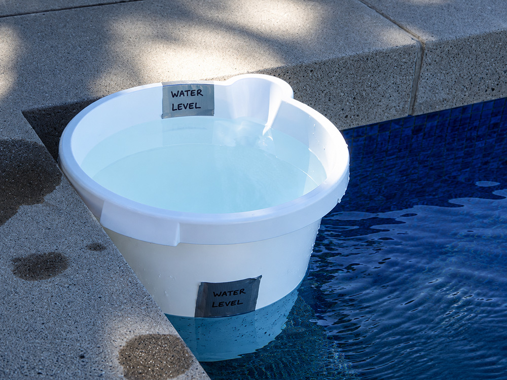 Pool bucket test used to compare evaporation and pool water loss