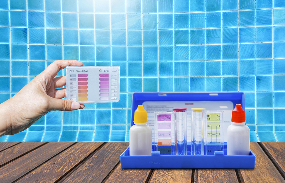 Pool water test kit checking chlorine and pH levels