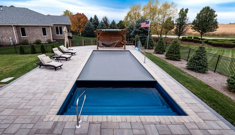 Stone pool patio and raised backyard entertaining space in Minnesota