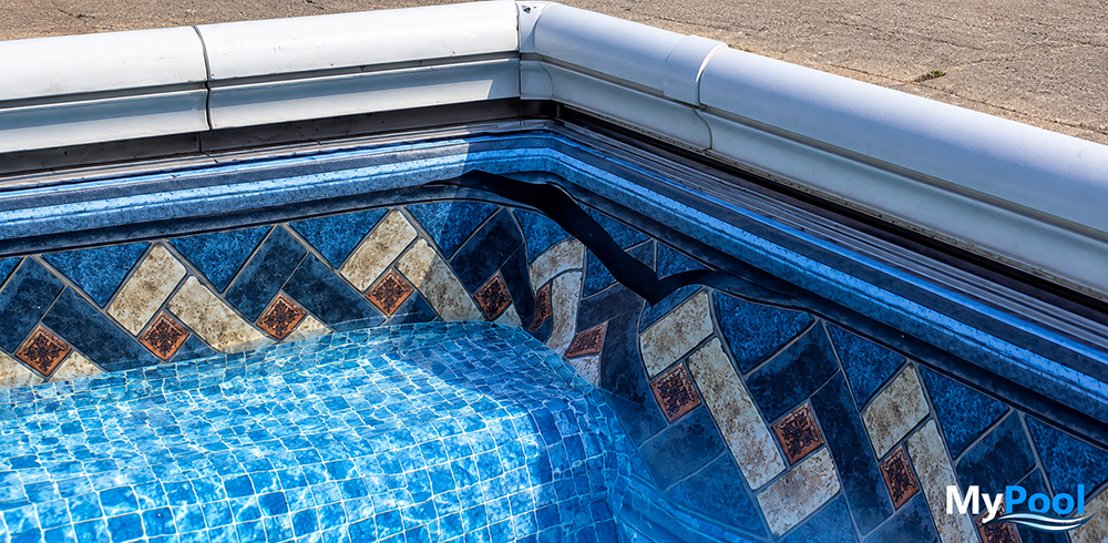 Vinyl pool liner tear causing water loss near the pool wall