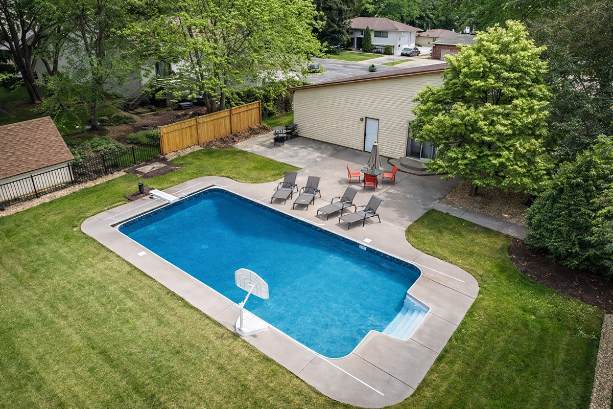 18 by 36 Minnesota rectangle pool with surrounding patio